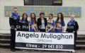 Angela Mullaghan presents St.Mary’s Rasharkin U16 Camogs with new playing jerseys.